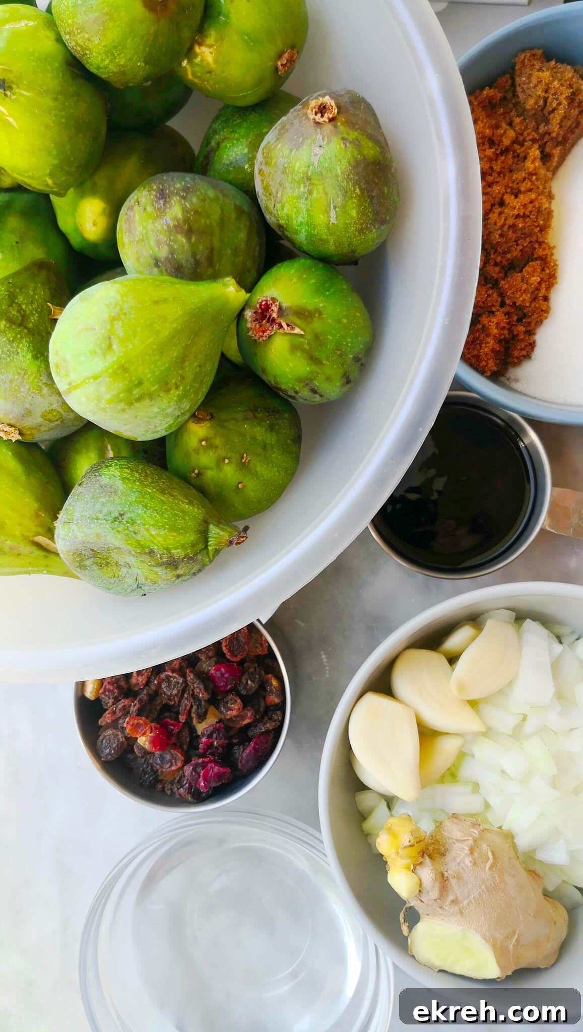 Ingredients for fig chutney laid out on a marble board.