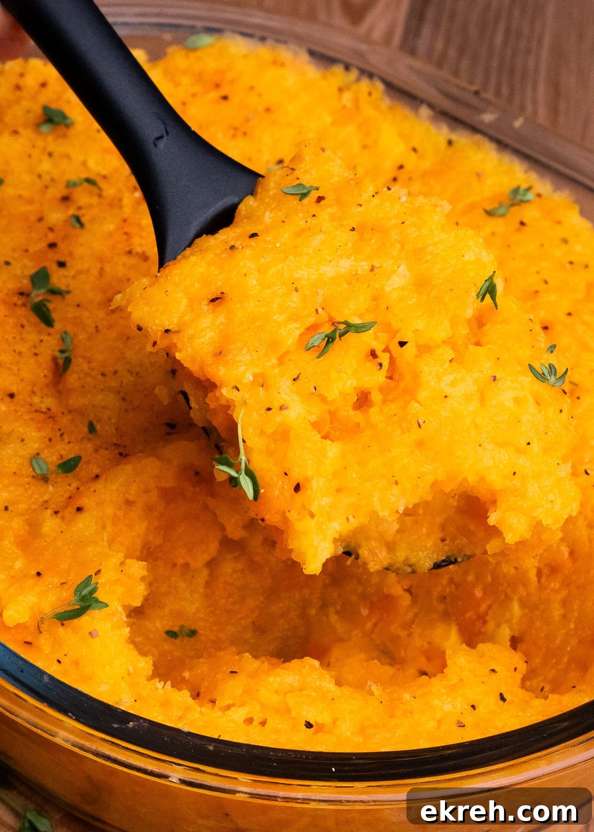 Carrot and Swede Mash being picked up with a spoon