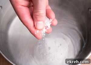 Sprinkling salt into a pot of water