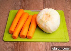 Four carrots,one swede on a green chopping board