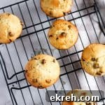 Overhead view of banana ricotta muffins spread out on cooling rack