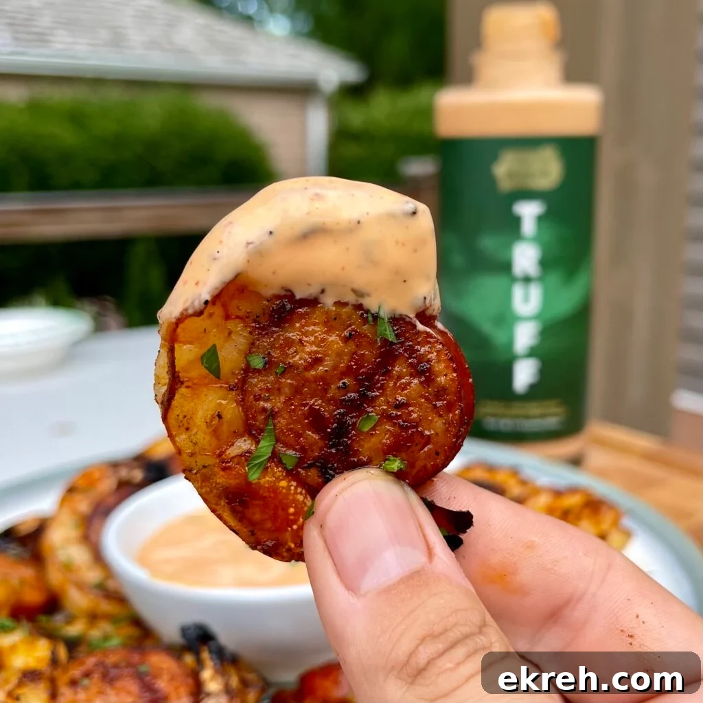 Shrimp wrapped sausage served with dipping sauce