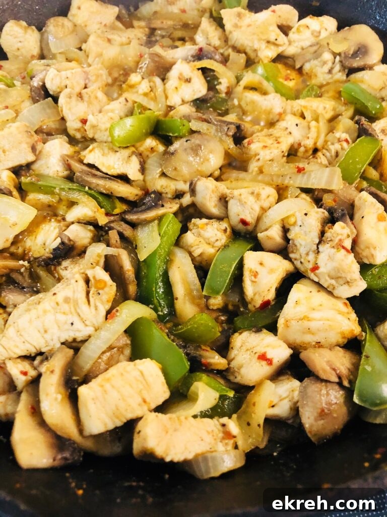 Air Fryer Philly Chicken Burritos Recipe 3 chicken philly filling in a skillet after cooking