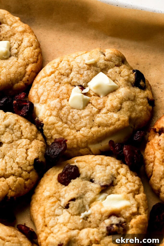 Chewy White Chocolate Cranberry Cookies 4 white chocolate cranberry cookies on a tray