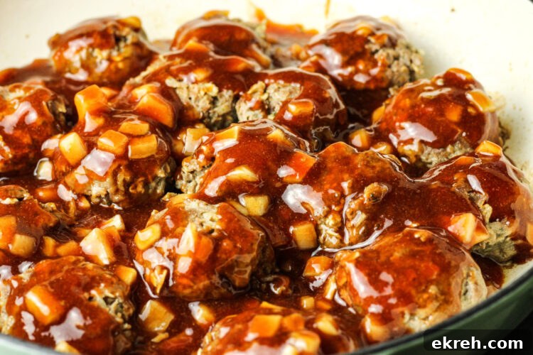 30-Minute Sweet and Sour Meatballs Recipe 5 meatballs covered in sweet and sour sauce