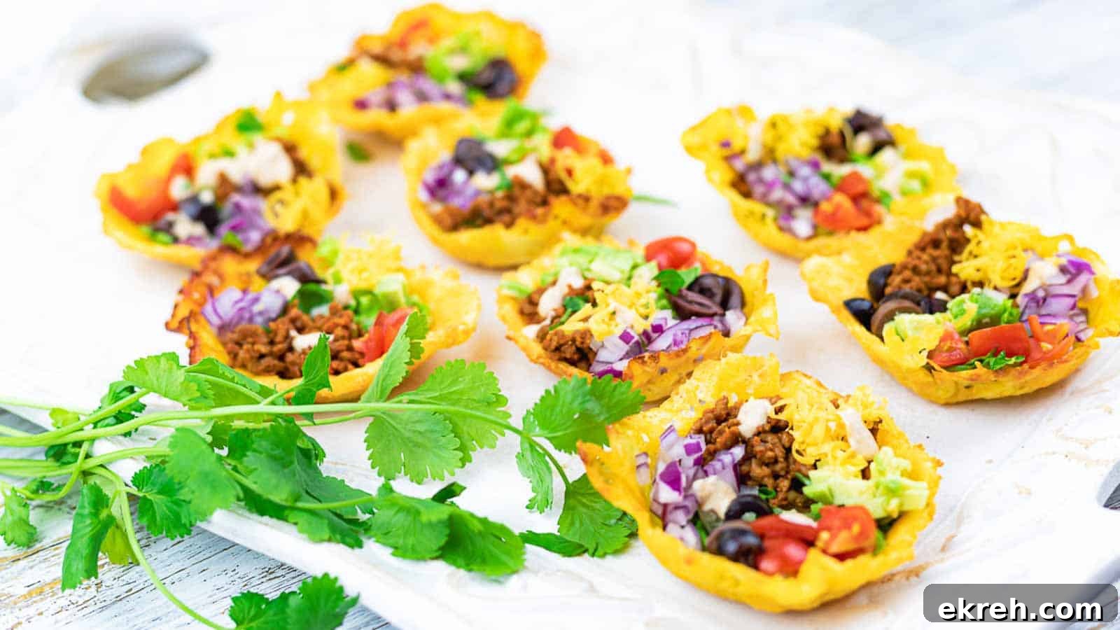 Easy Crunchy Keto Taco Cups on a white board with cilantro.