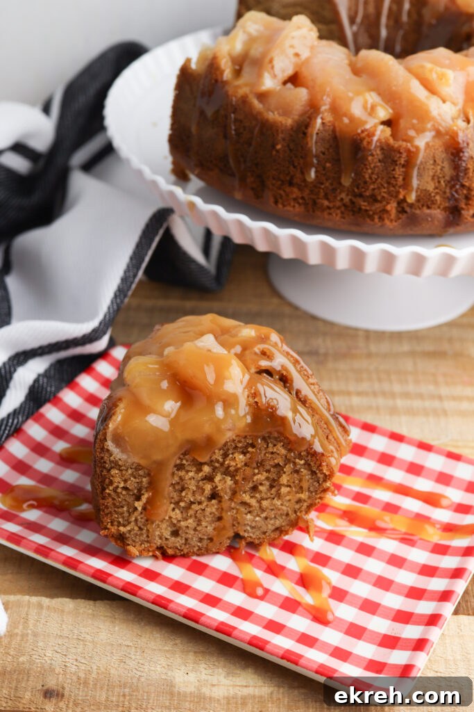 How to Make Caramel Apple Upside-Down Cake 3 Sliced apple upside down cake served on a cake stand