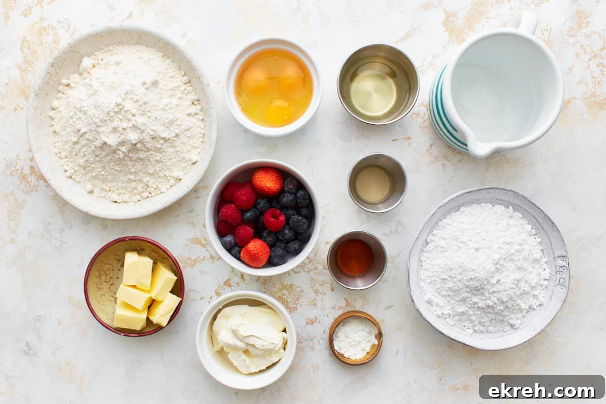 Ingredients for Berry-filled cupcakes arranged in dishes.
