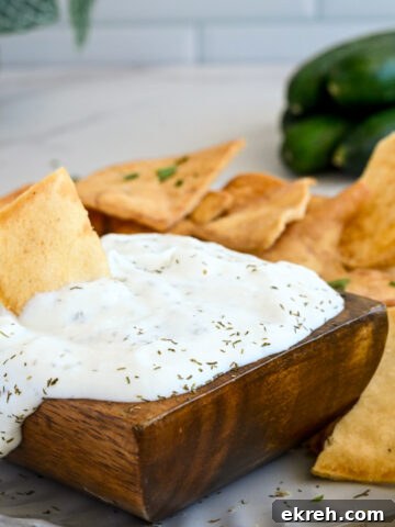 Tahini Sauce Recipe: Creamy Salad Dressing and Dips 15 Bowl of tzatziki sauce with pita chips.