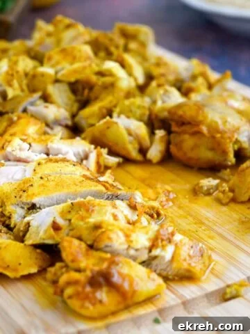 Tahini Sauce Recipe: Creamy Salad Dressing and Dips 16 Cutting board with prepared chicken shawarma.