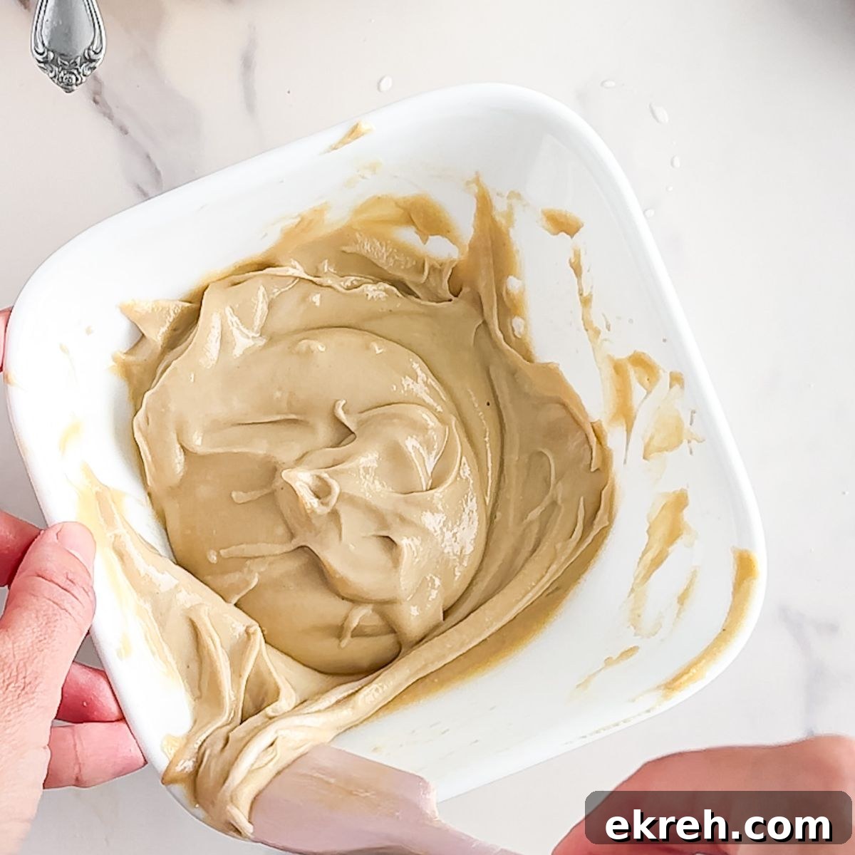 Tahini Sauce Recipe: Creamy Salad Dressing and Dips 6 Mixing the tahini sauce until it's smooth.