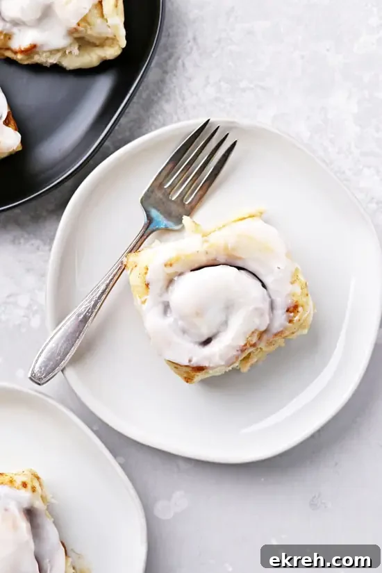 Dairy-Free Cinnamon Rolls Recipe: Soft, Gooey, Fluffy 5 Three plates filled with Non Dairy Cinnamon Rolls.