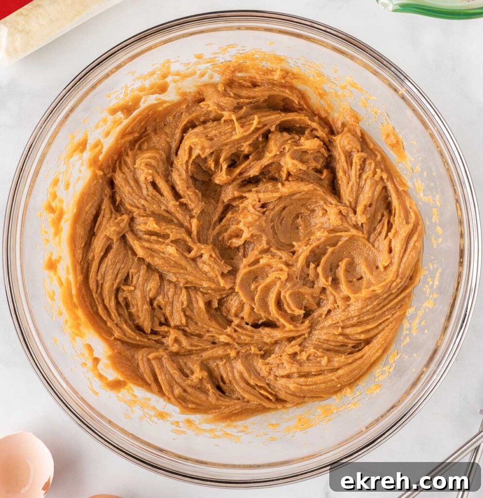 eggs, oil, and peanut butter in a mixing bowl mixed together