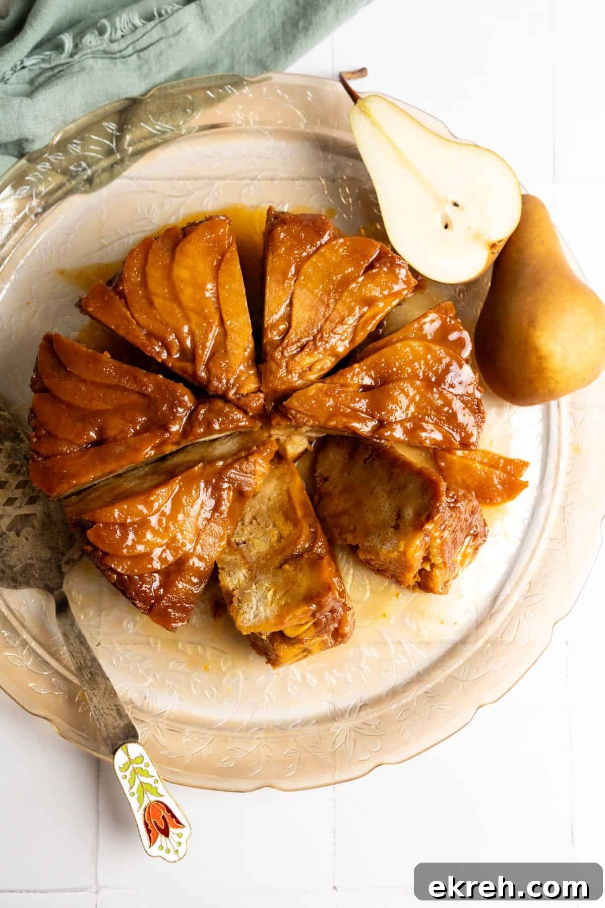 Precut bread pudding on a serving plate, some slices are on their sides.