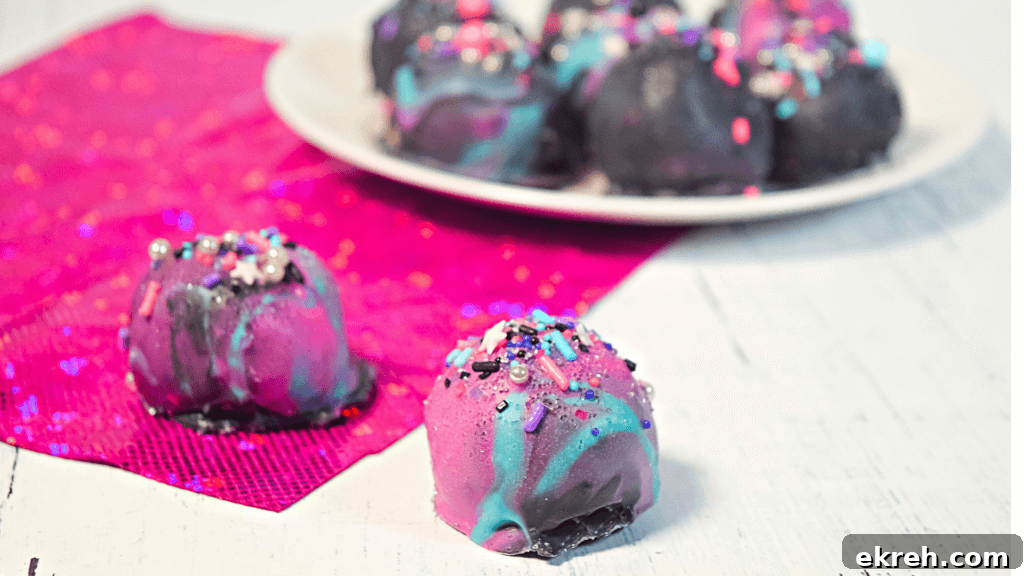 Close up image of two marbled moon rock cookie dough bites
