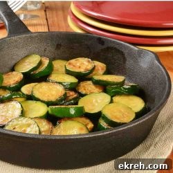 Sautéed zucchini in a cast iron skillet.