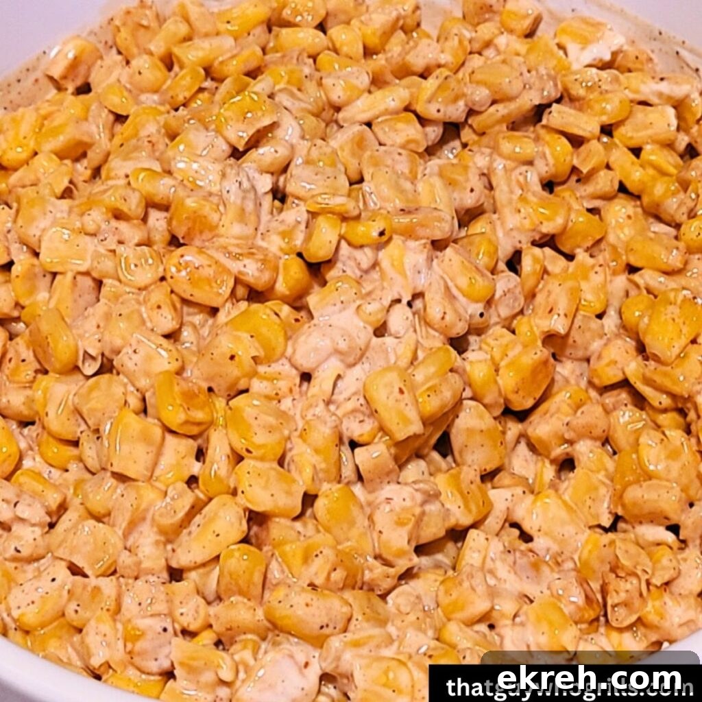 Cooked corn in a bowl ready to mix with dressing