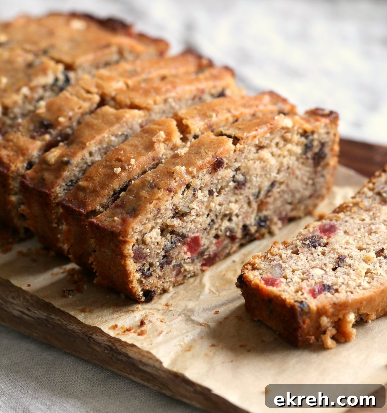 Vegan Gluten free Christmas Cake Fruit Cake on a cutting board