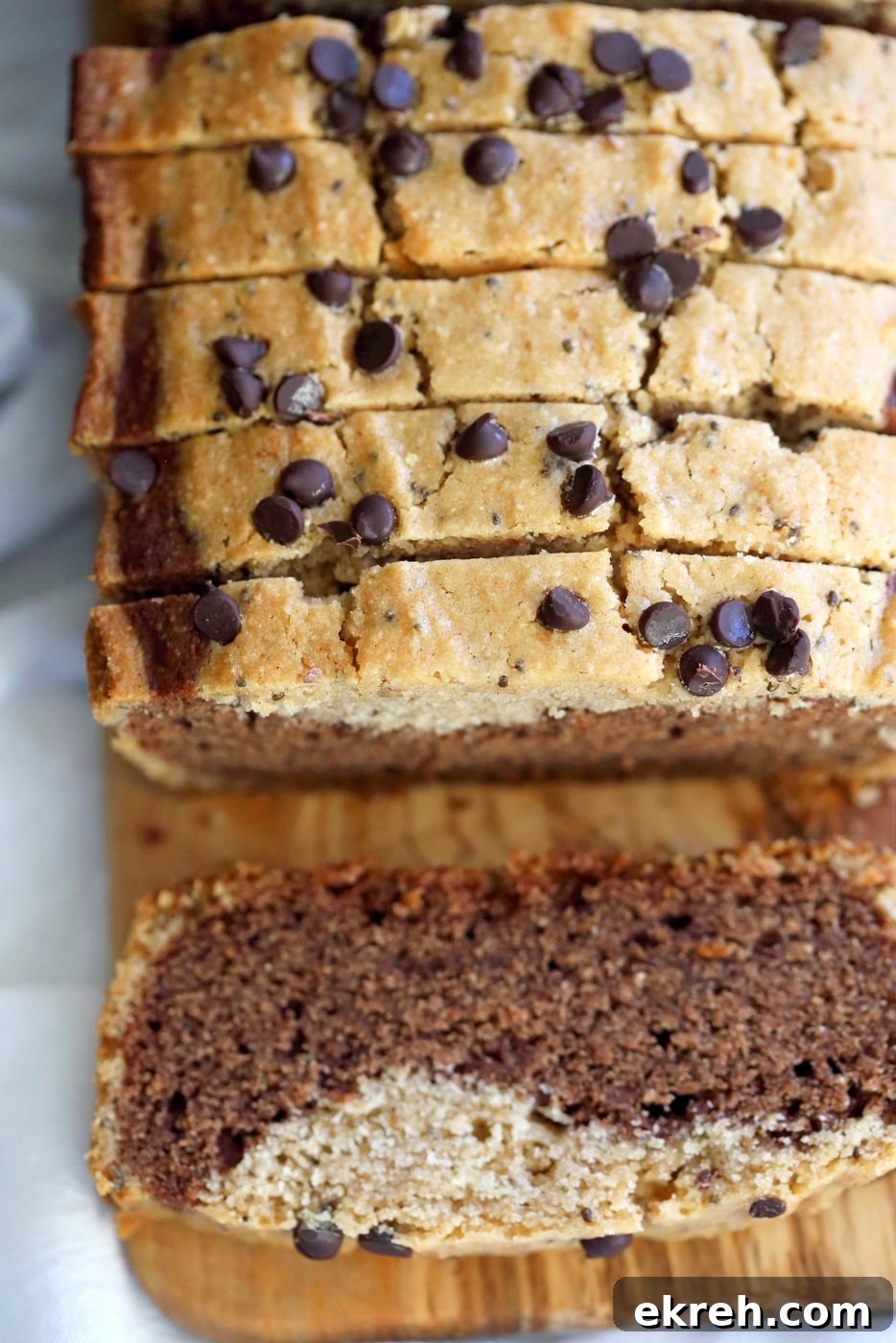 Gluten-free Cashew Butter Chocolate Marble Cake on a wooden board