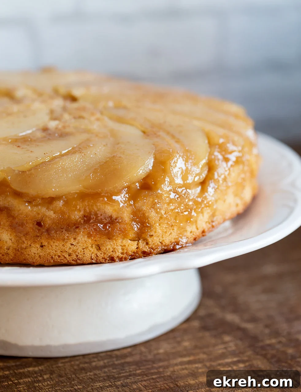 Pear Upside Down Cake on a cake stand 
