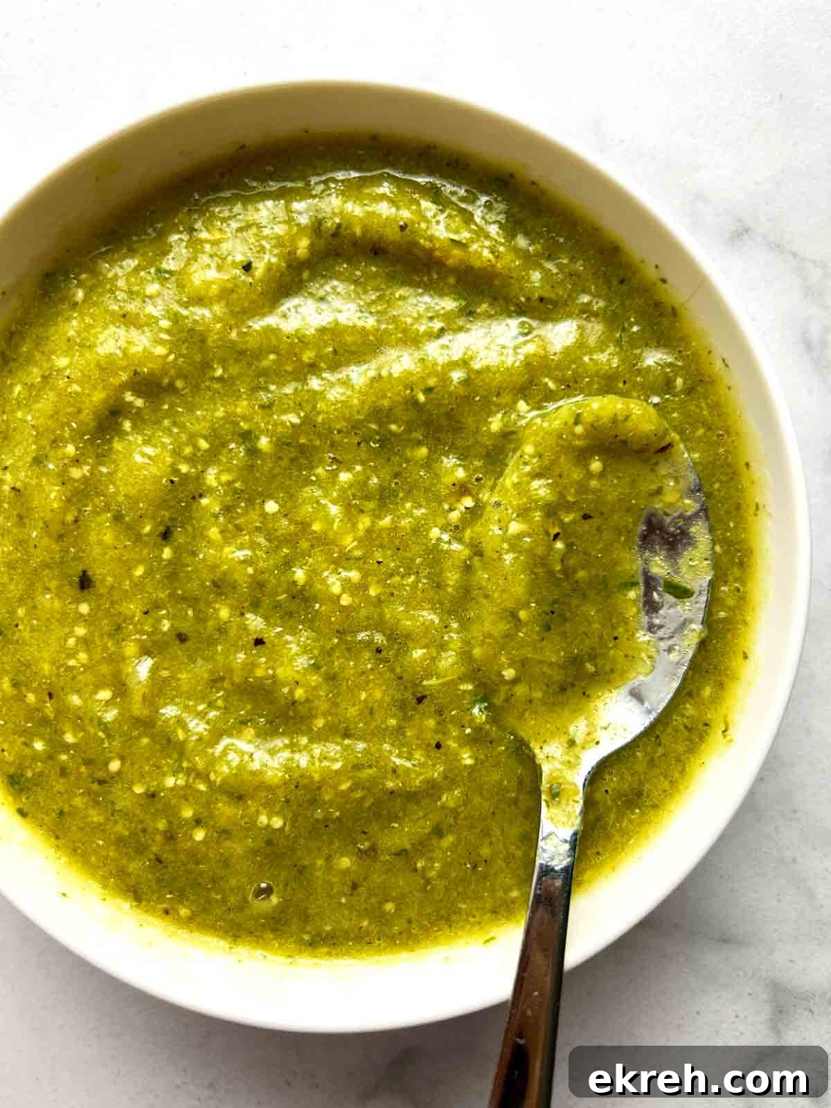 close up of salsa verde in white bowl.