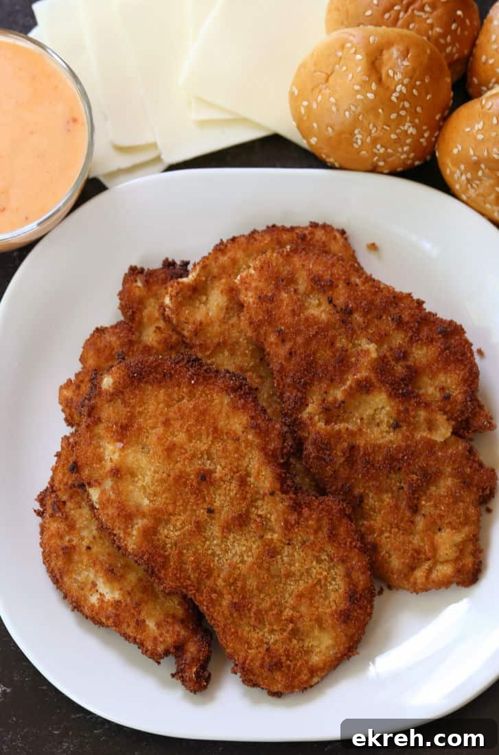 fried chicken cutlets with slider buns, mozzarella cheese and bang bang sauce