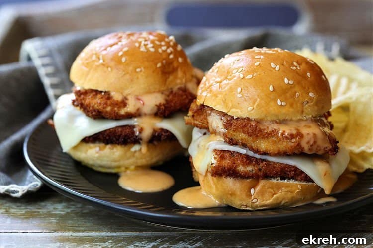 Bang Bang Chicken Sliders on a black plate