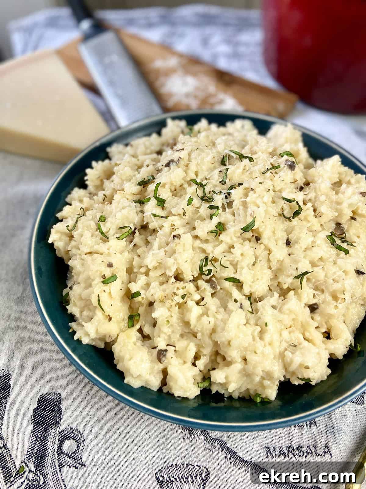 Risotto in green serving bowl.
