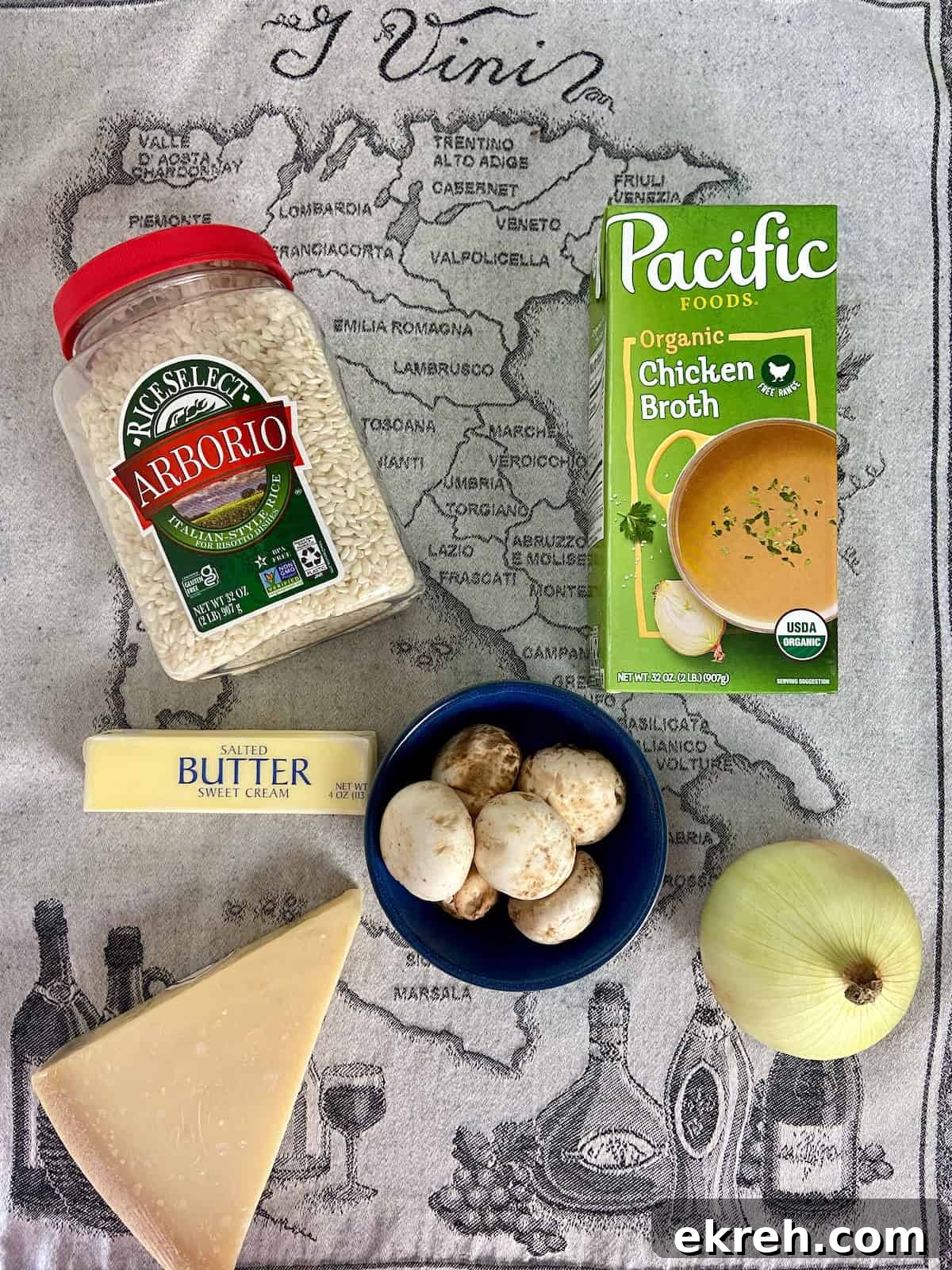 Risotto ingredients on Italian dish towel.