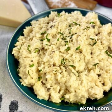 Mushroom risotto in green bowl.