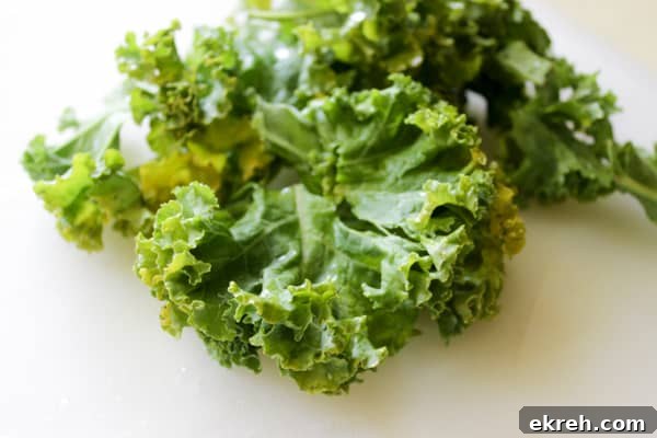 Kale leaves on white surface