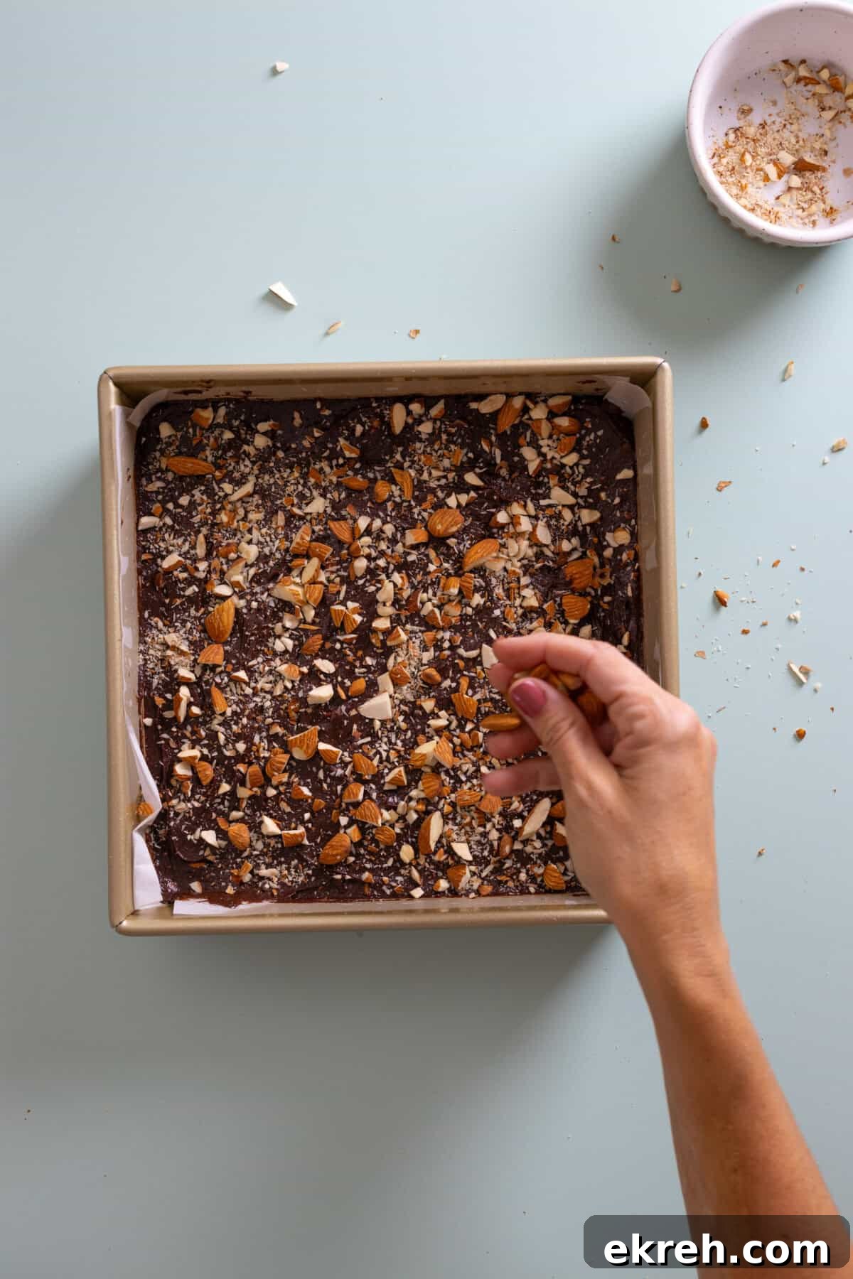 Fudgy Mocha Almond Brownies Recipe 9 adding almonds to mocha brownie batter