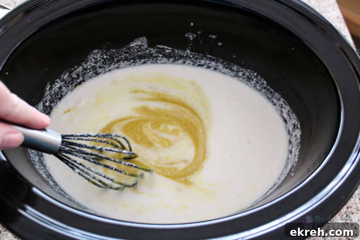 Coconut milk after whisking and adding curry, just beginning to mix.