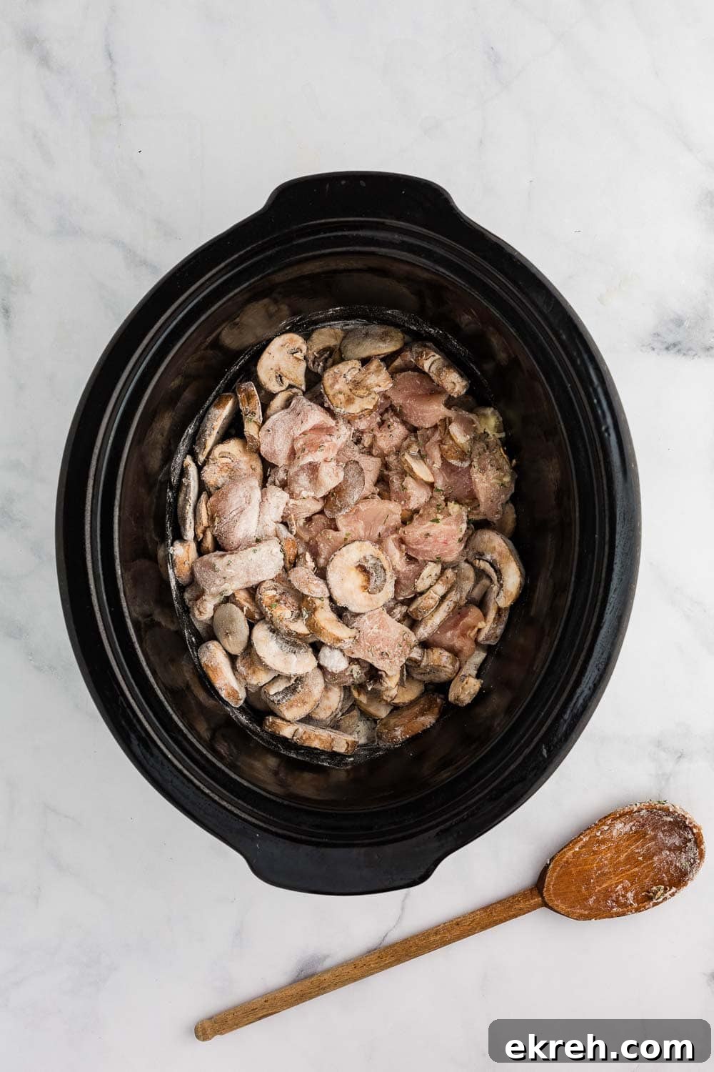 mushroom and flour in black slow cooker