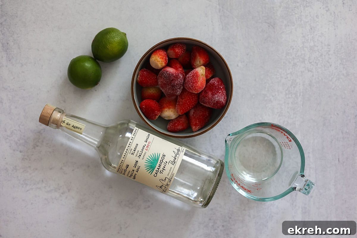 frozen strawberries, simple syrup, two limes, and a bottle of tequila.