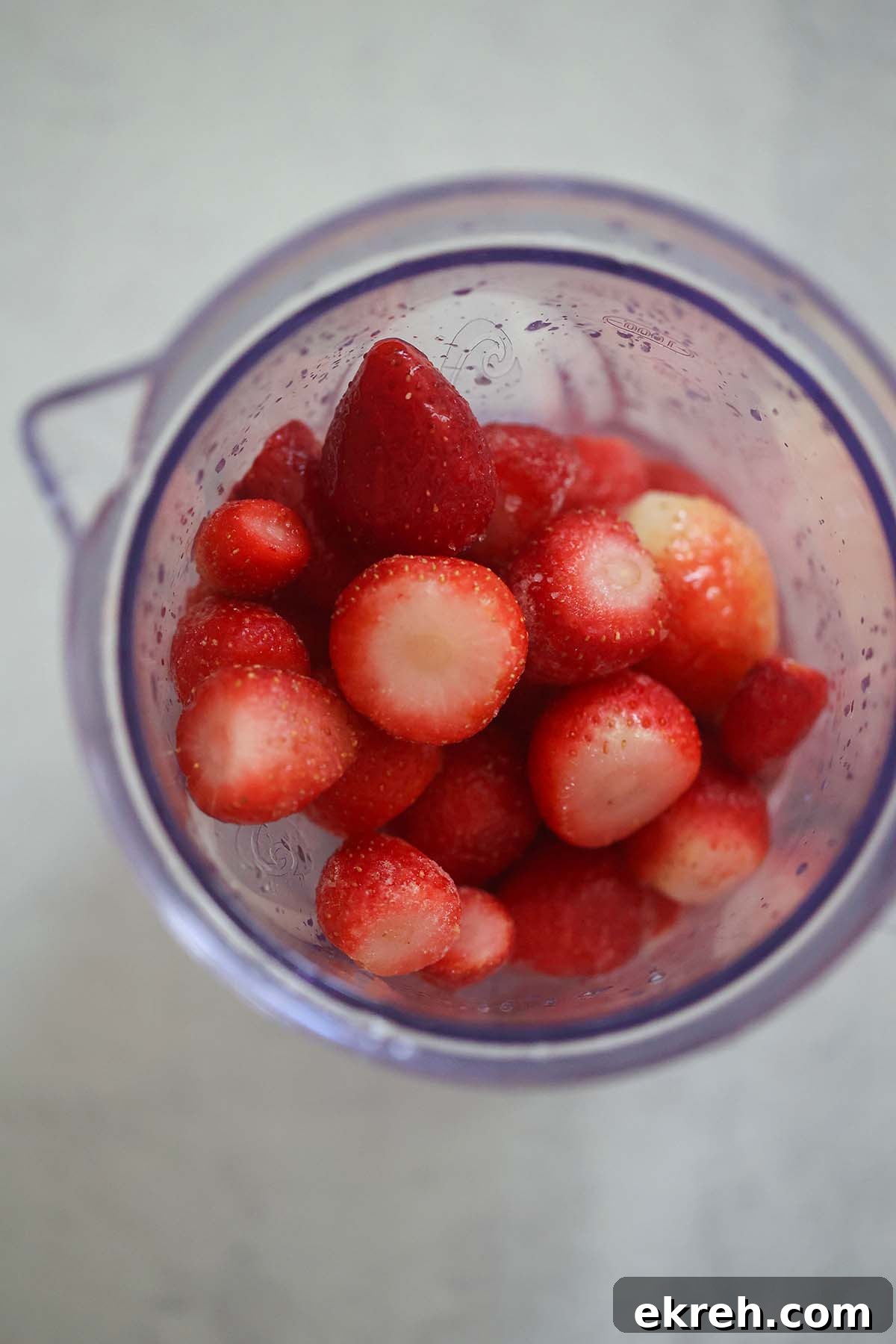 Frozen strawberries in a blender.