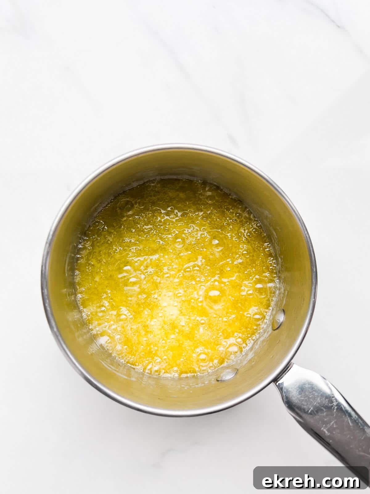 Butter sizzling in a pan to boil off the water and make brown butter.