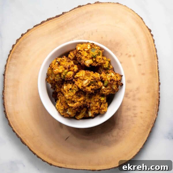 Delicious plate of vegan fritters with cabbage, red onions and jalapenos