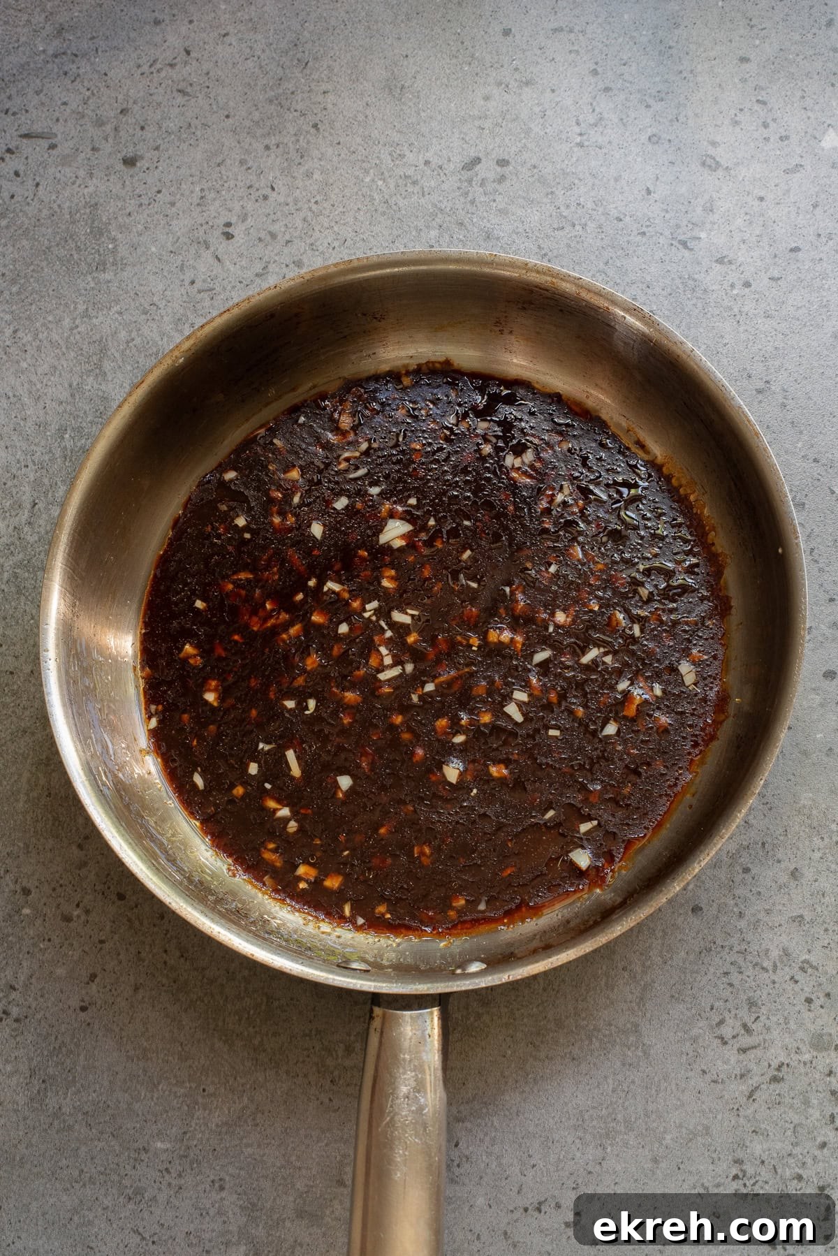 An overhead image of whipping up the sauce.