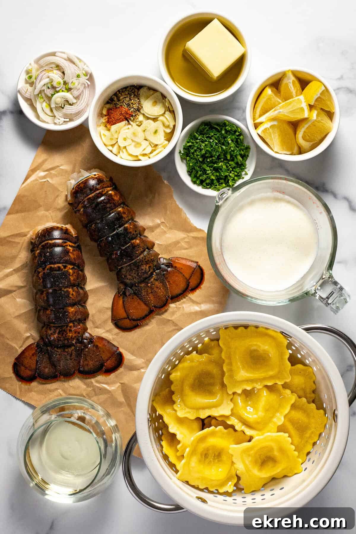 White marble countertop with ingredients to make lobster ravioli sauce