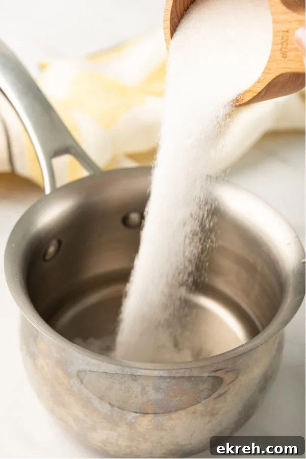 adding sugar to the water
