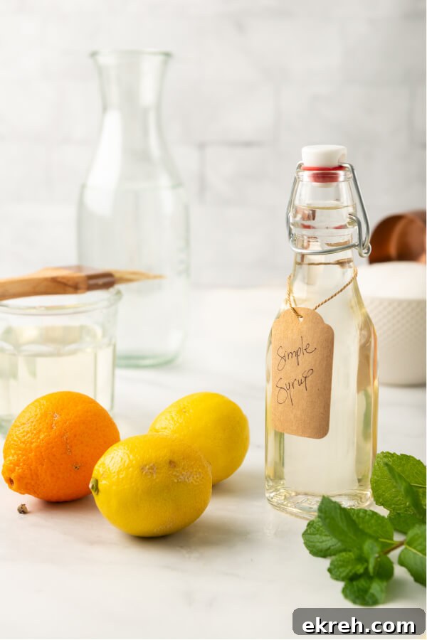 citrus and mint with a bottle of simple syrup