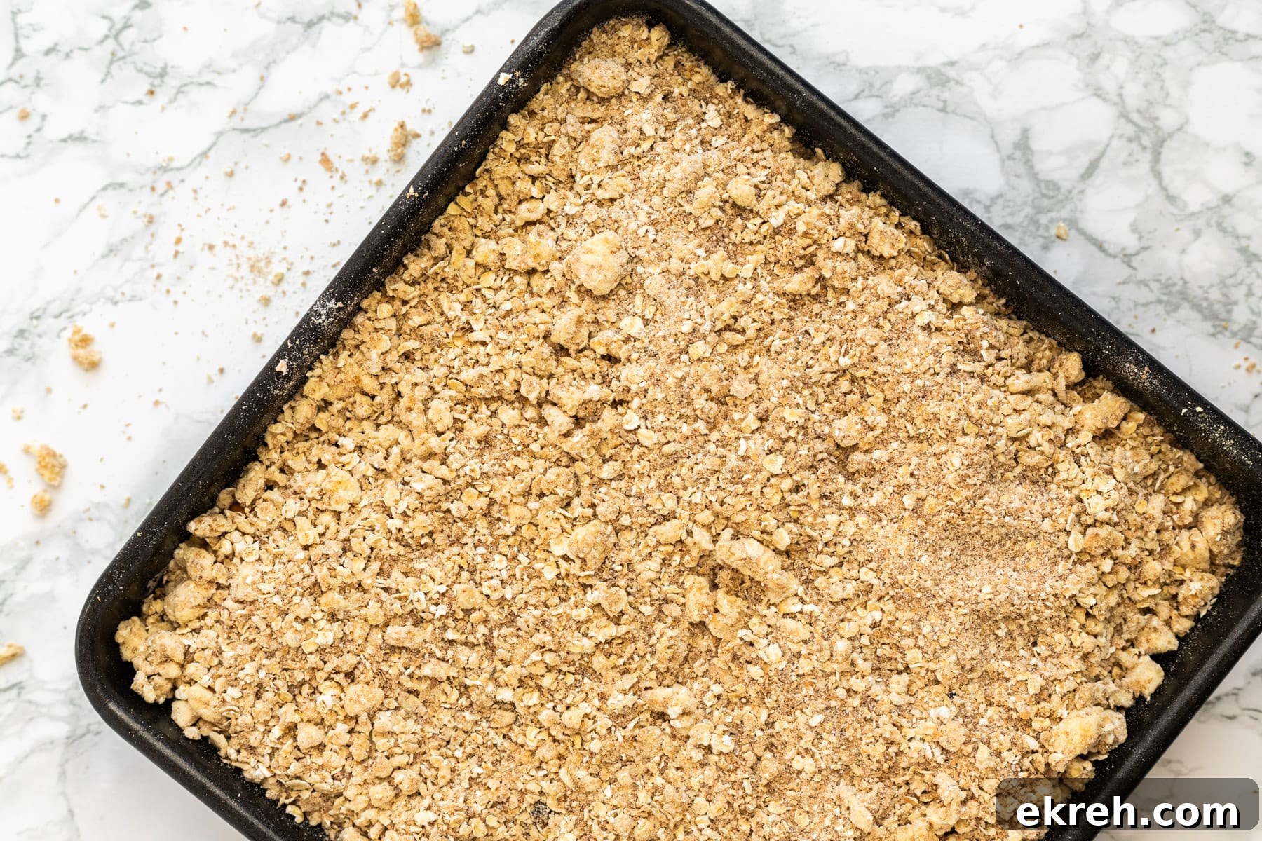 a top down view of an unbaked mango crisp.