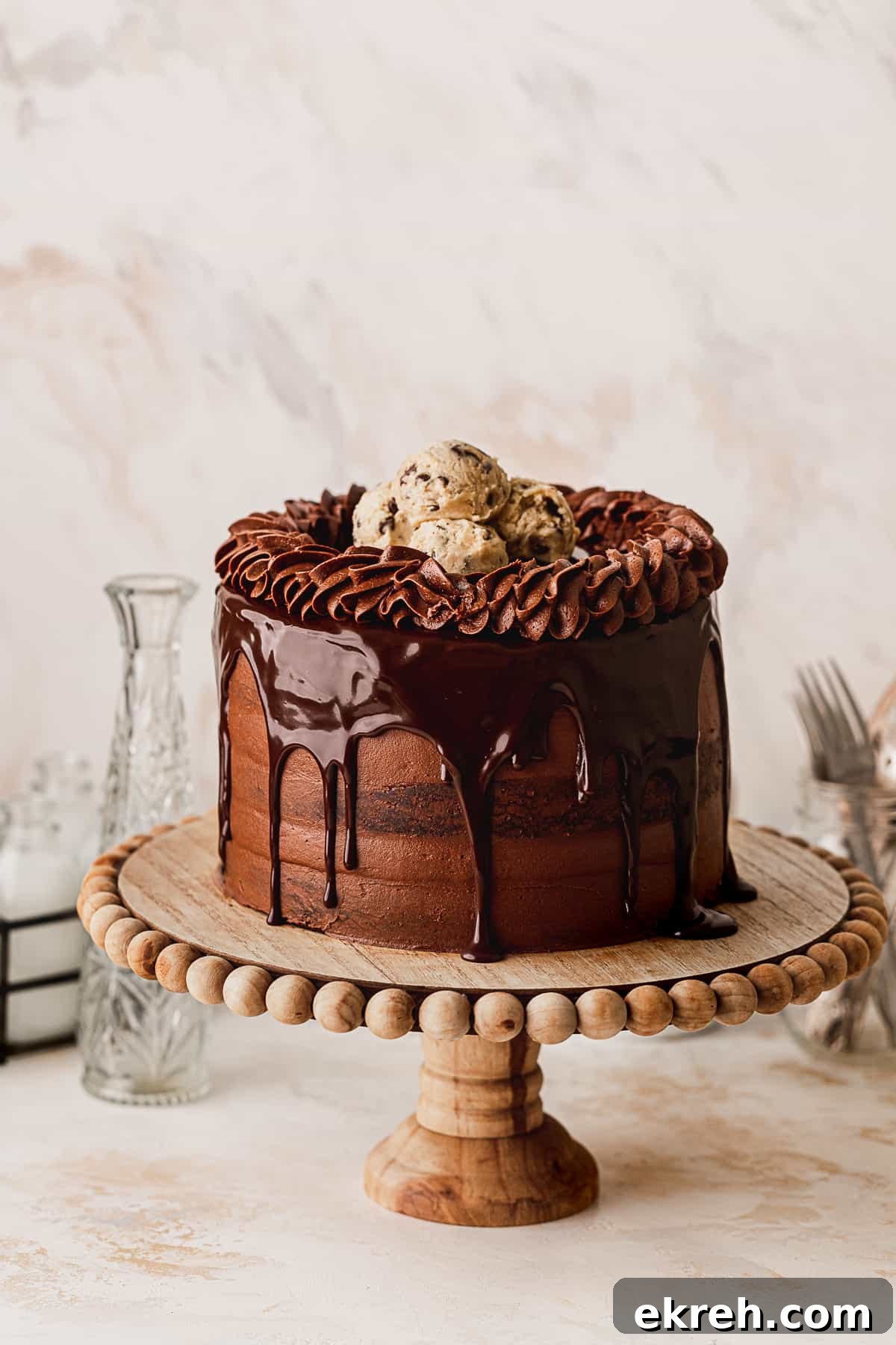 Chocolate brownie cookie cake on a cake stand.