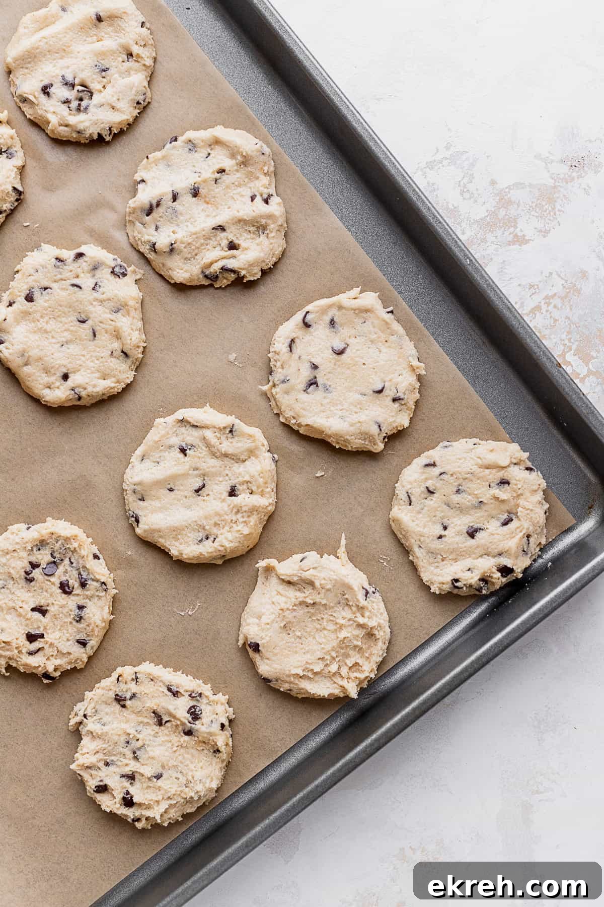 Cookie dough discs on cookie sheet.