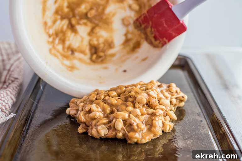 Spread peanut brittle on baking sheet