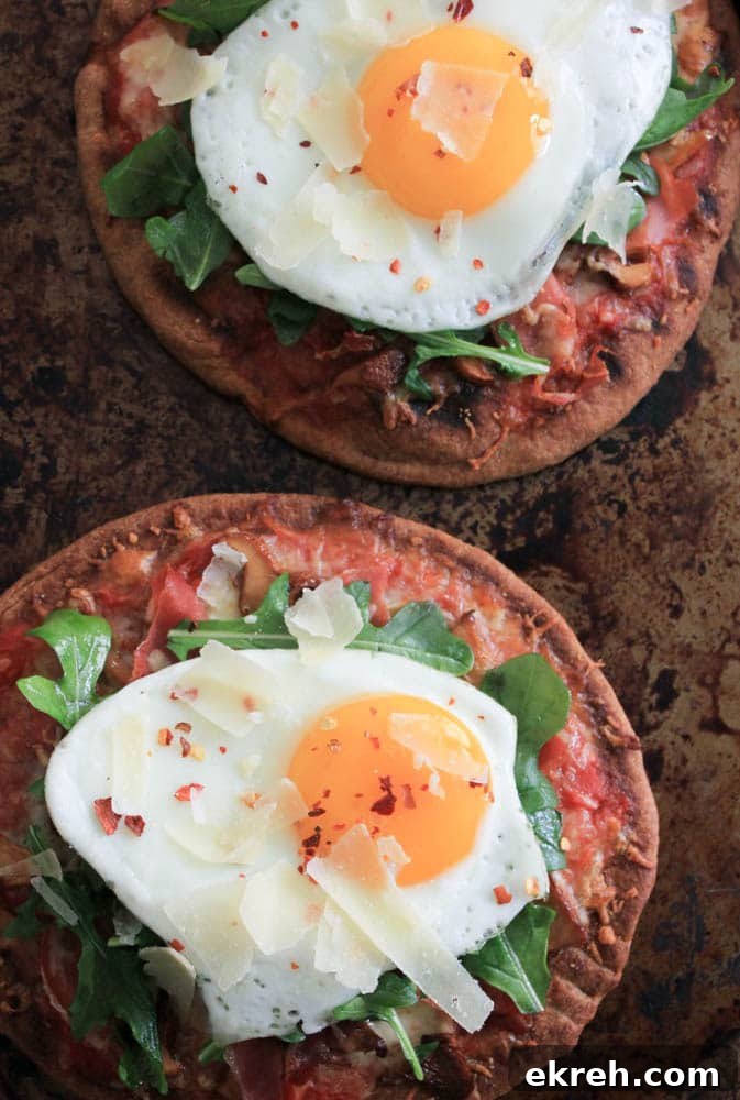 grilled-pita-pizzas-with-prosciutto-chanterelles-arugula-and-a-fried-egg