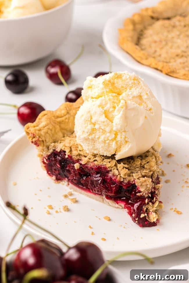 Cherry Crumb Pie with Frozen Tart Cherries 6 Cherry pie slice with vanilla ice cream on top