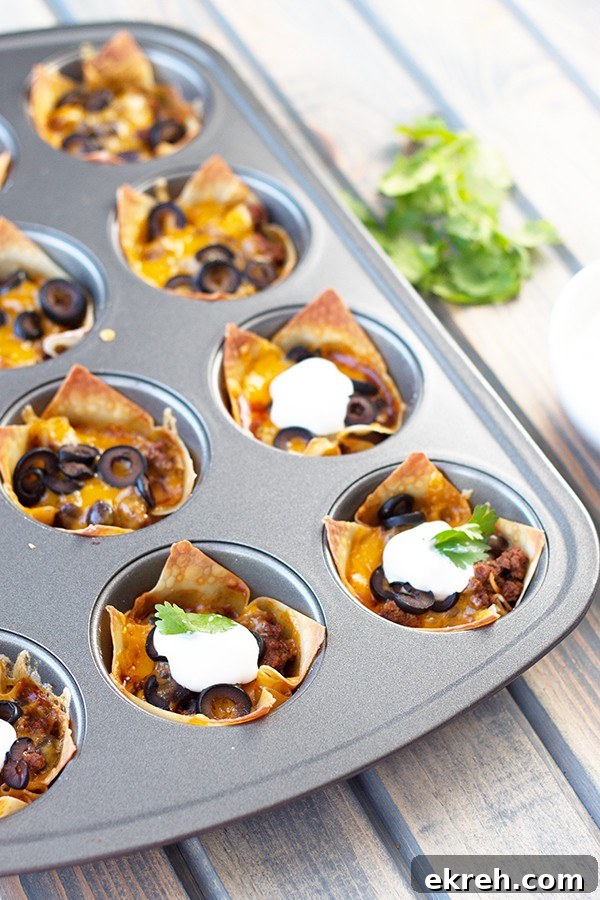 Mini Beef Enchilada Cups Recipe 3 cupcake tray full of cooked beef enchilada cups