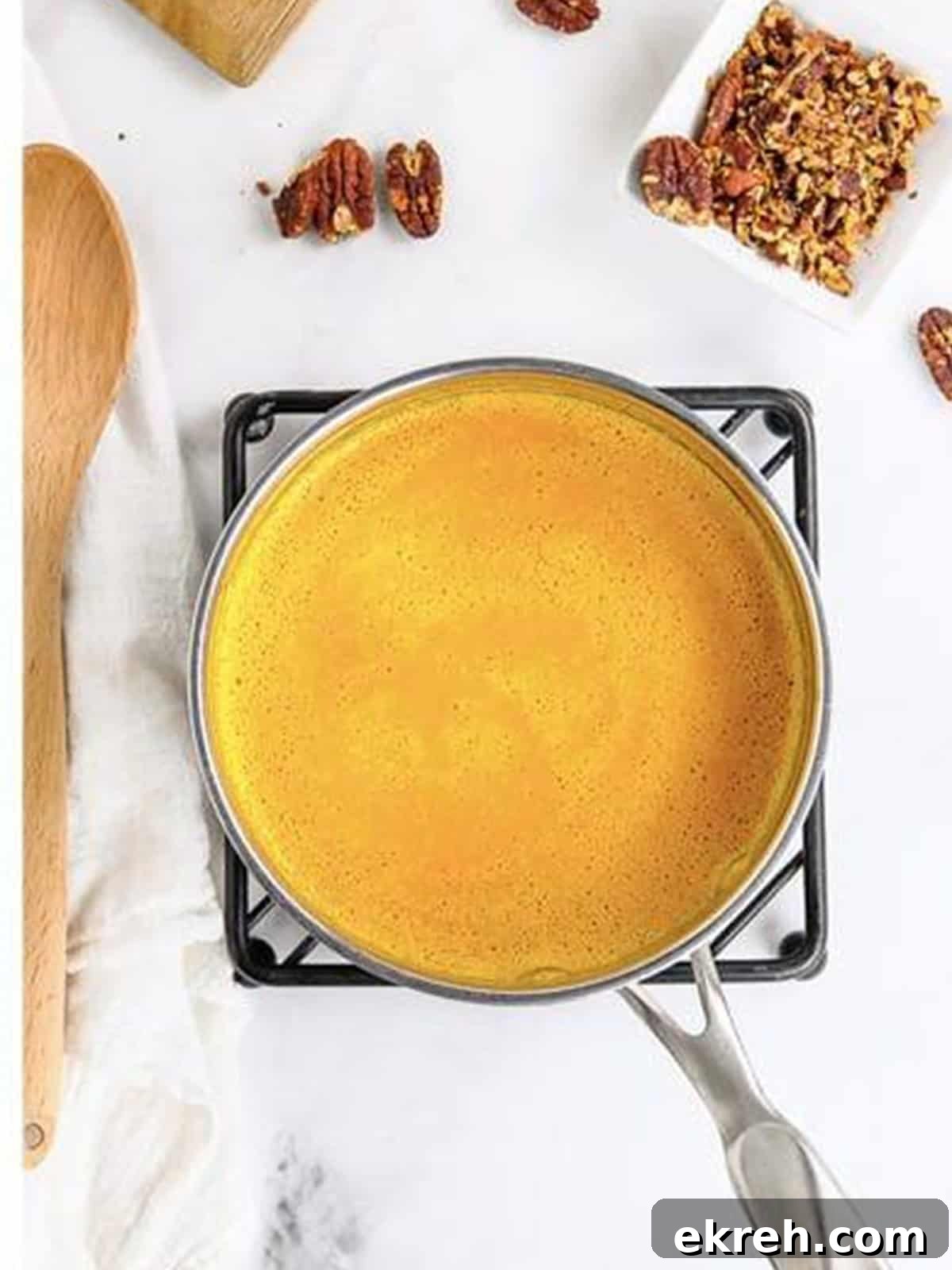 Smooth, creamy carrot soup in a pot ready to serve.